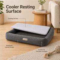 Gray pet bed with cooling gel pad in a living room setting