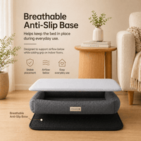 Gray pet bed with Cooling Gel Mat for Dogs and a breathable anti-slip base in a living room setting