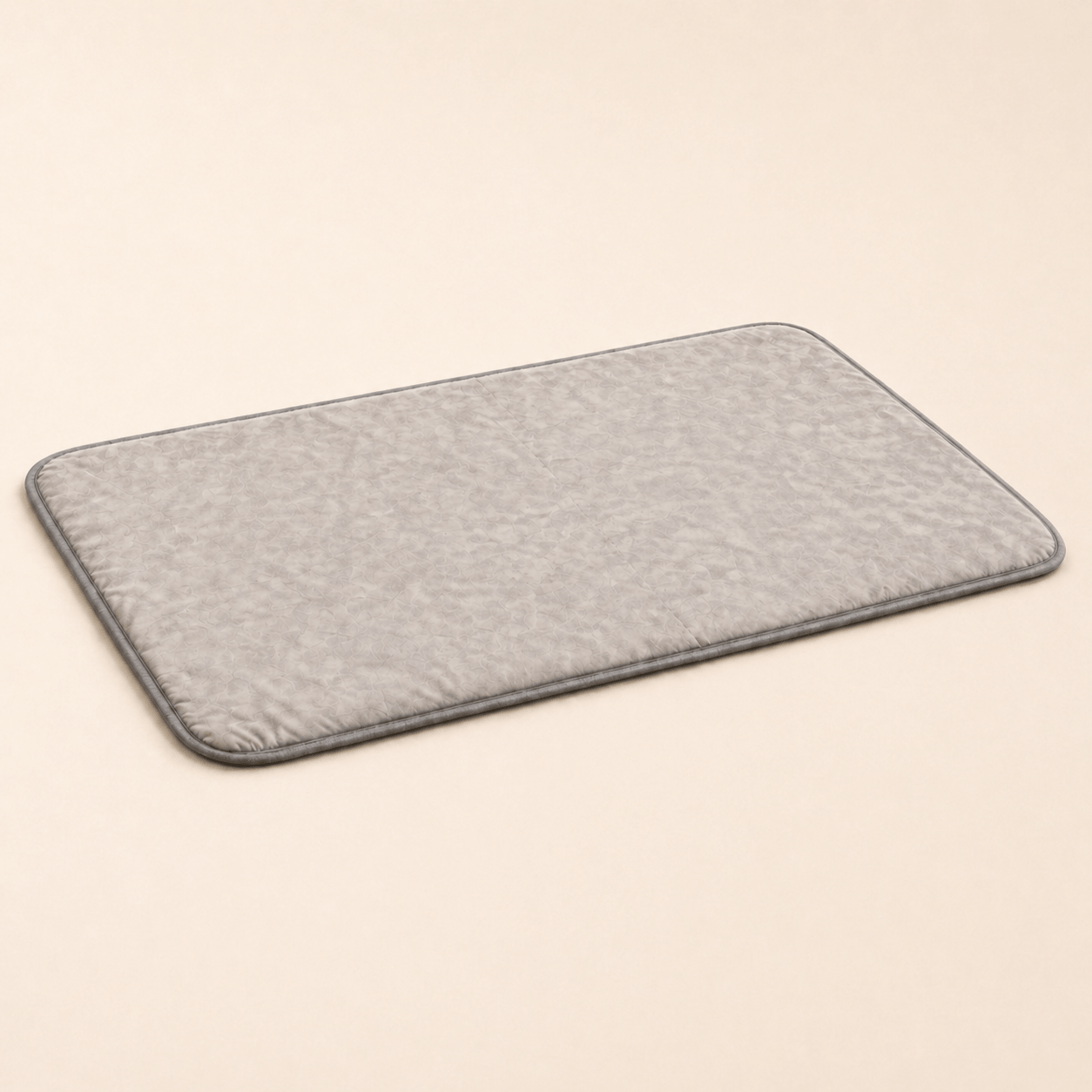 Gray Cooling Gel Mat for Dogs on a beige background